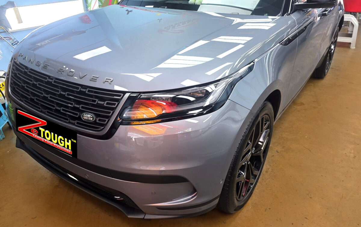 The Range Rover Velar's coated paintwork under workshop lighting.