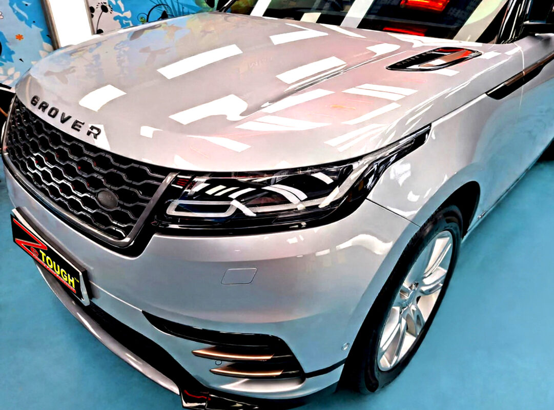 The Range Rover Velar's coated paintwork under workshop lighting.