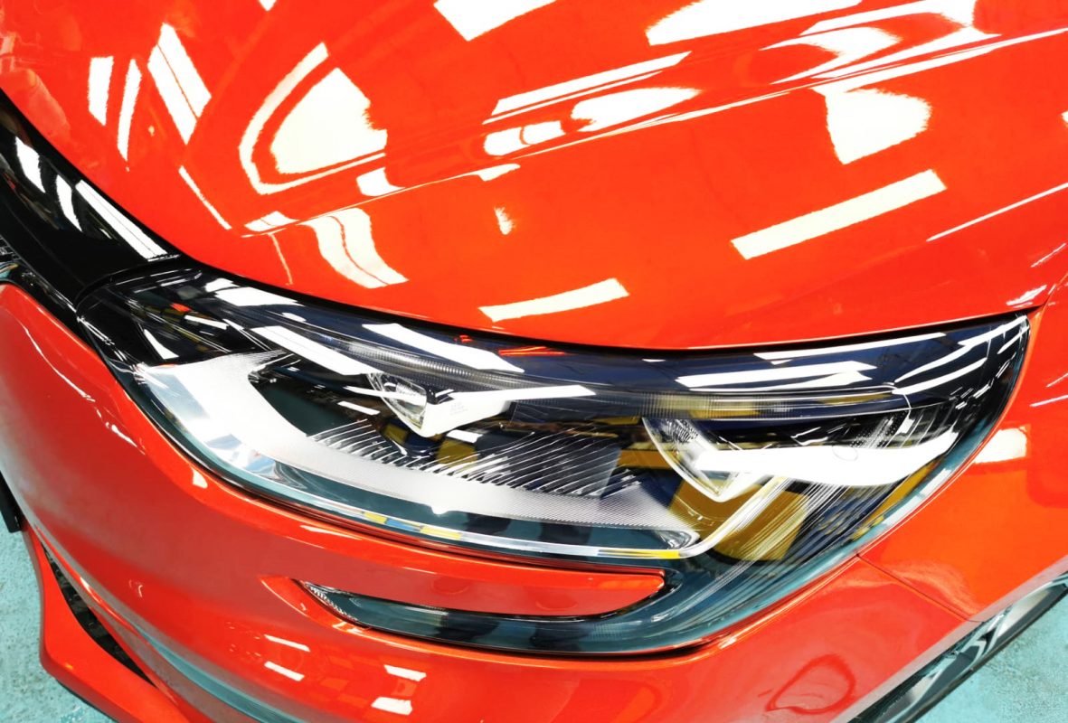 The Megane's coated paintwork showing clean reflections.
