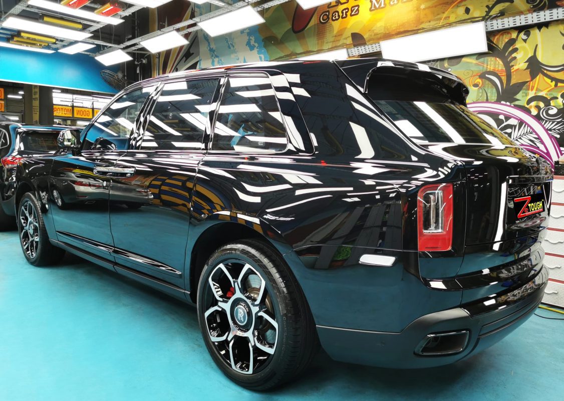 Rear quarter of the Rolls-Royce Cullinan, glossy and protected.