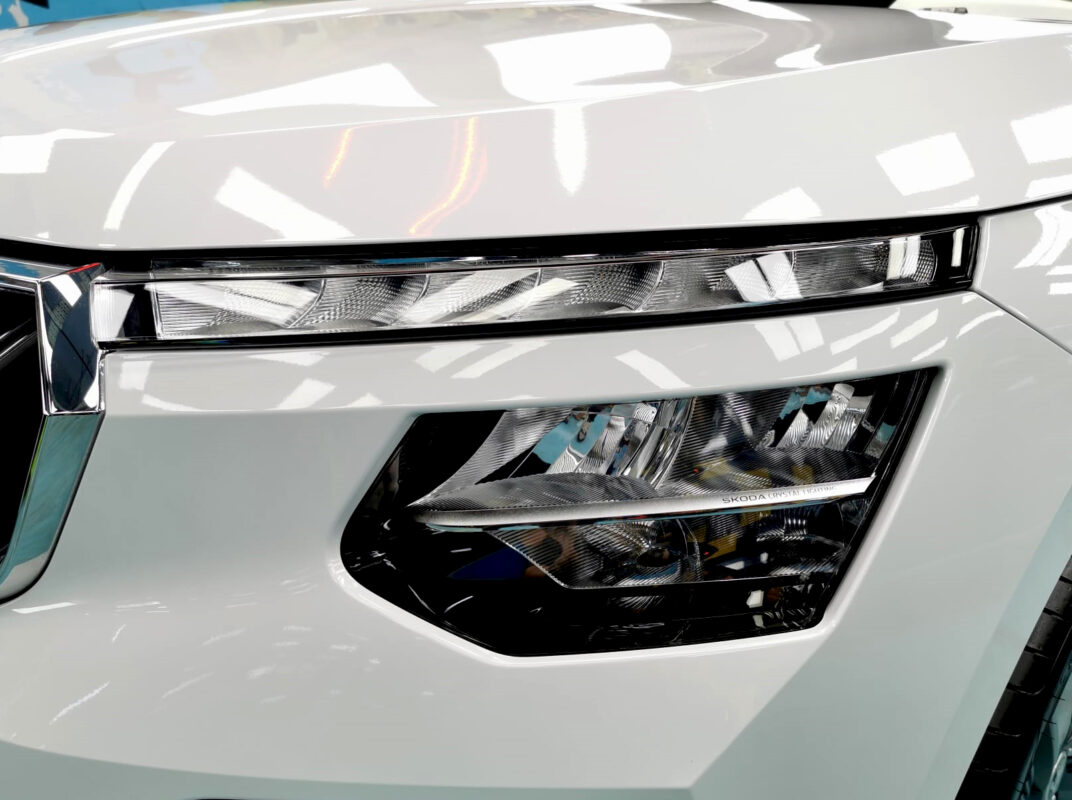 The Kamiq's coated paintwork showing clean reflections.