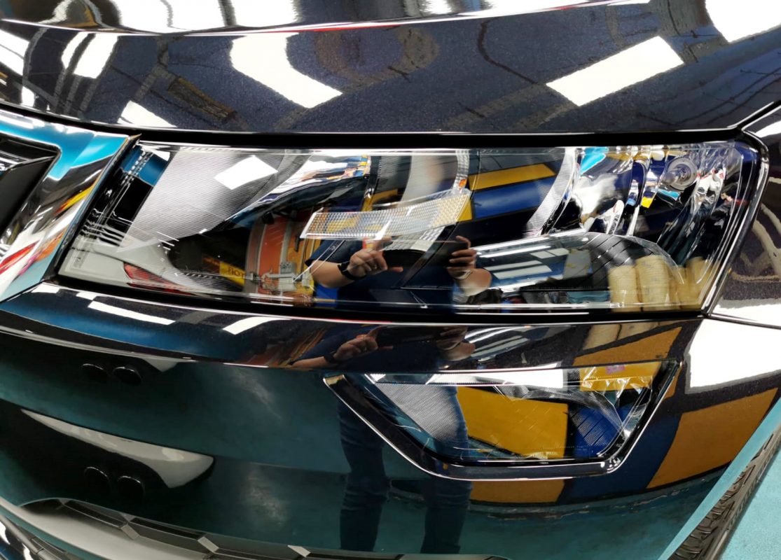The Karoq's coated paintwork showing clean reflections.