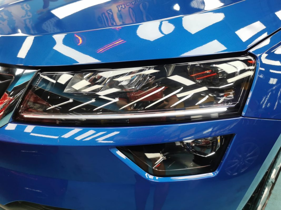 The Karoq's coated paintwork showing clean reflections.