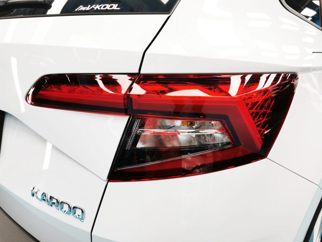 The coated bonnet of the Skoda Karoq under workshop lighting.