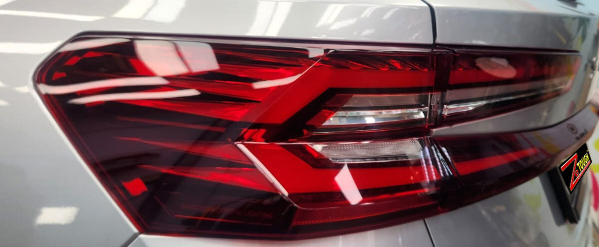 The coated bonnet of the Skoda Kodiaq under workshop lighting.