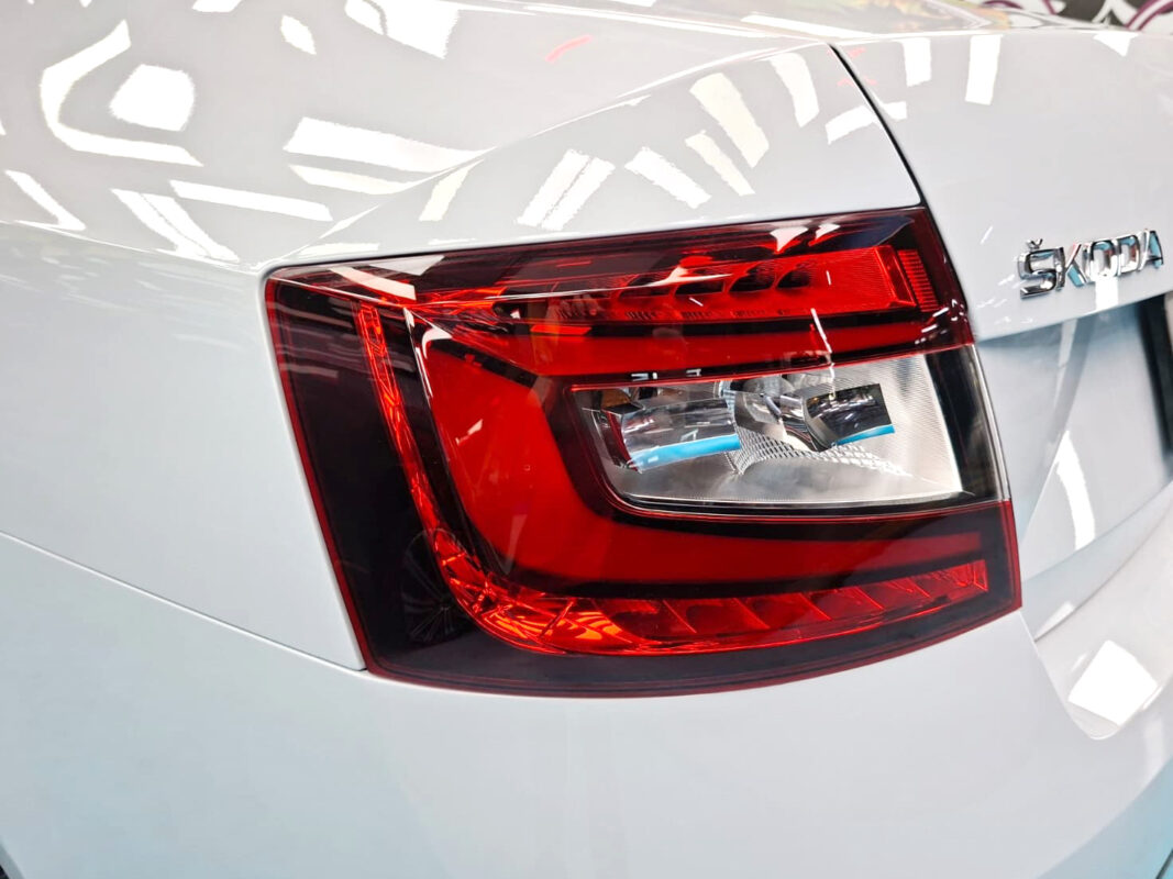 The coated bonnet of the Skoda Octavia under workshop lighting.