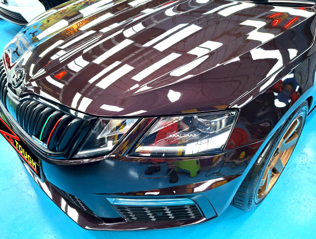 The Skoda Octavia's coated paintwork under workshop lighting.