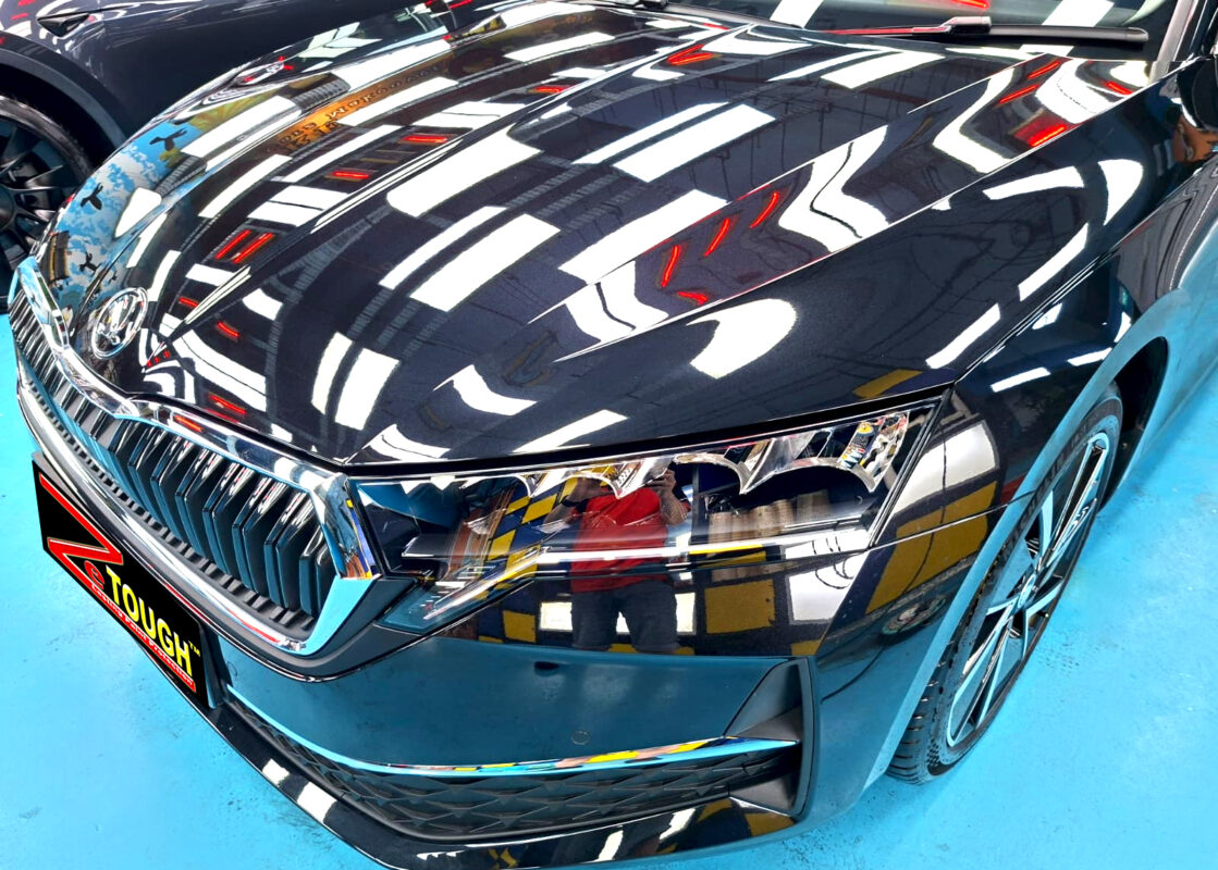 The Skoda Octavia's coated paintwork under workshop lighting.