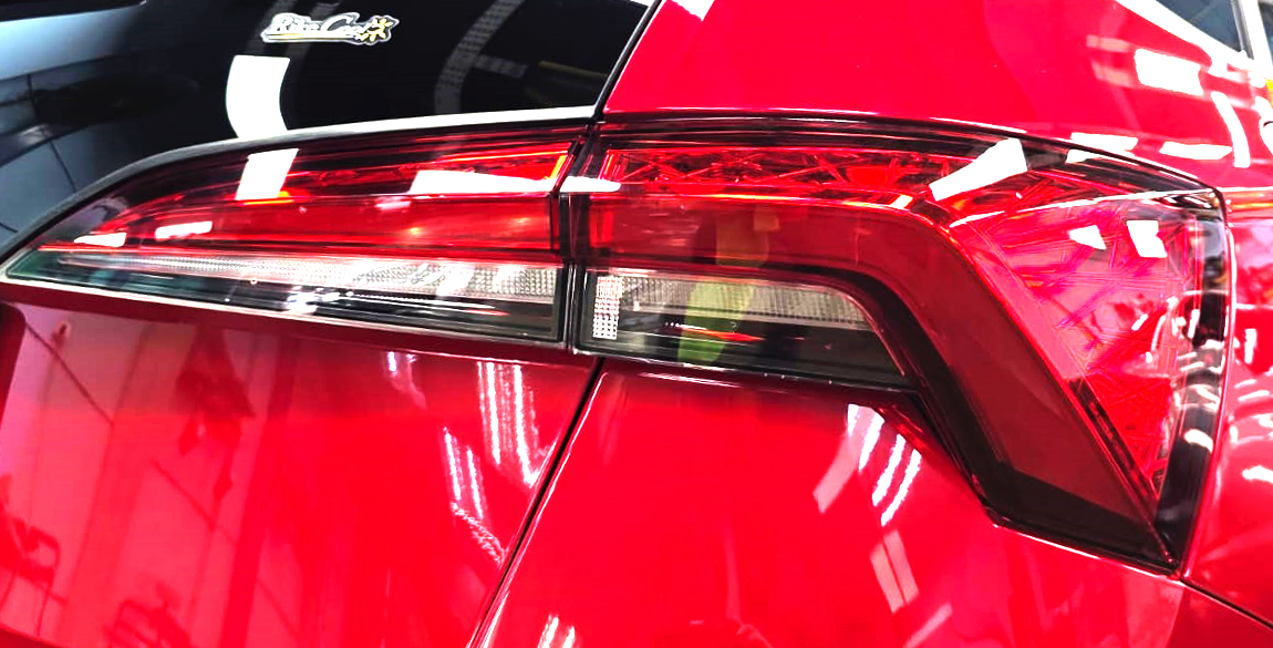 The coated bonnet of the Skoda Scala under workshop lighting.