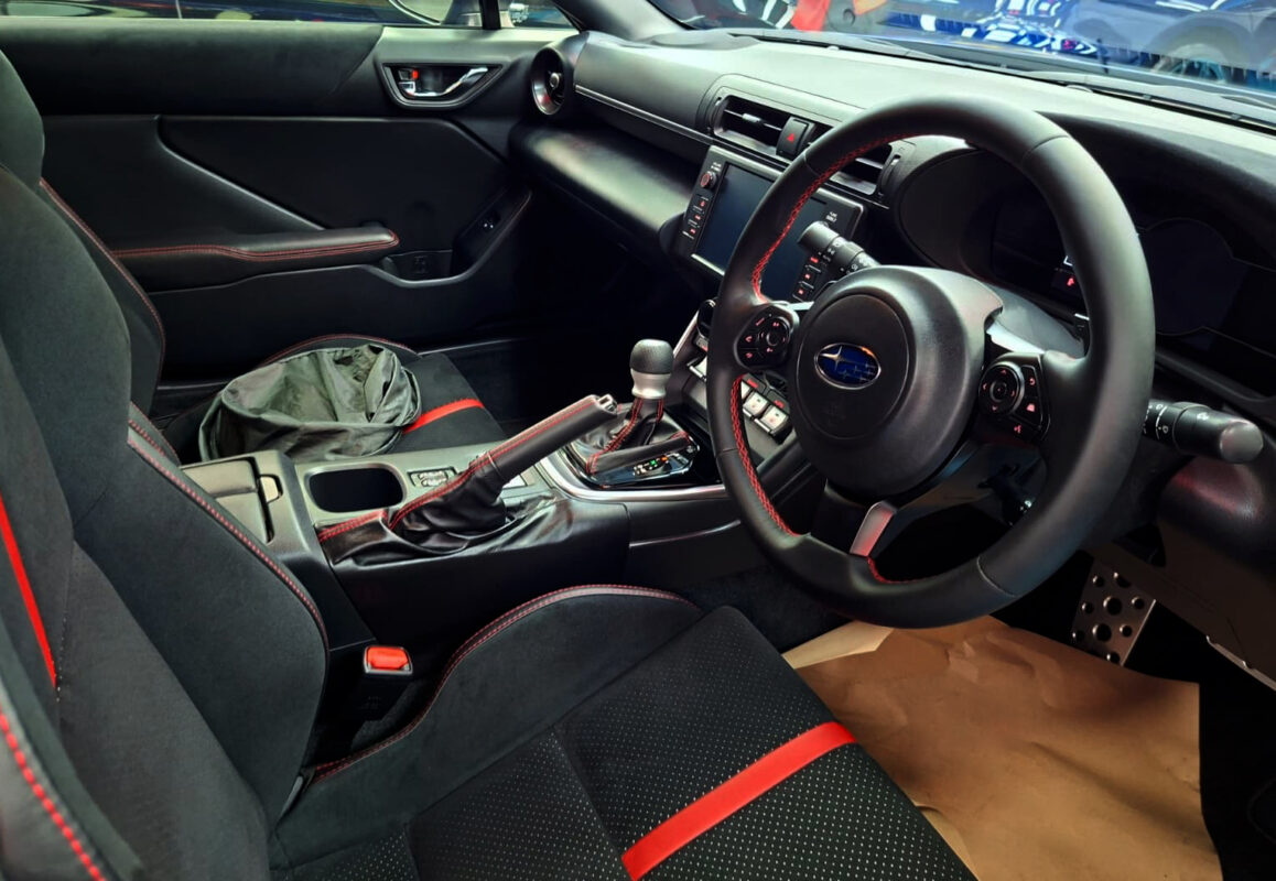 Reflections across the coated panels of the Subaru BRZ.