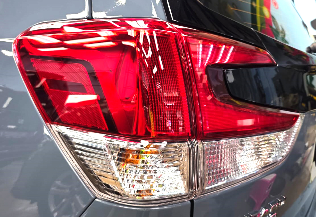 The coated bonnet of the Subaru Forester under workshop lighting.