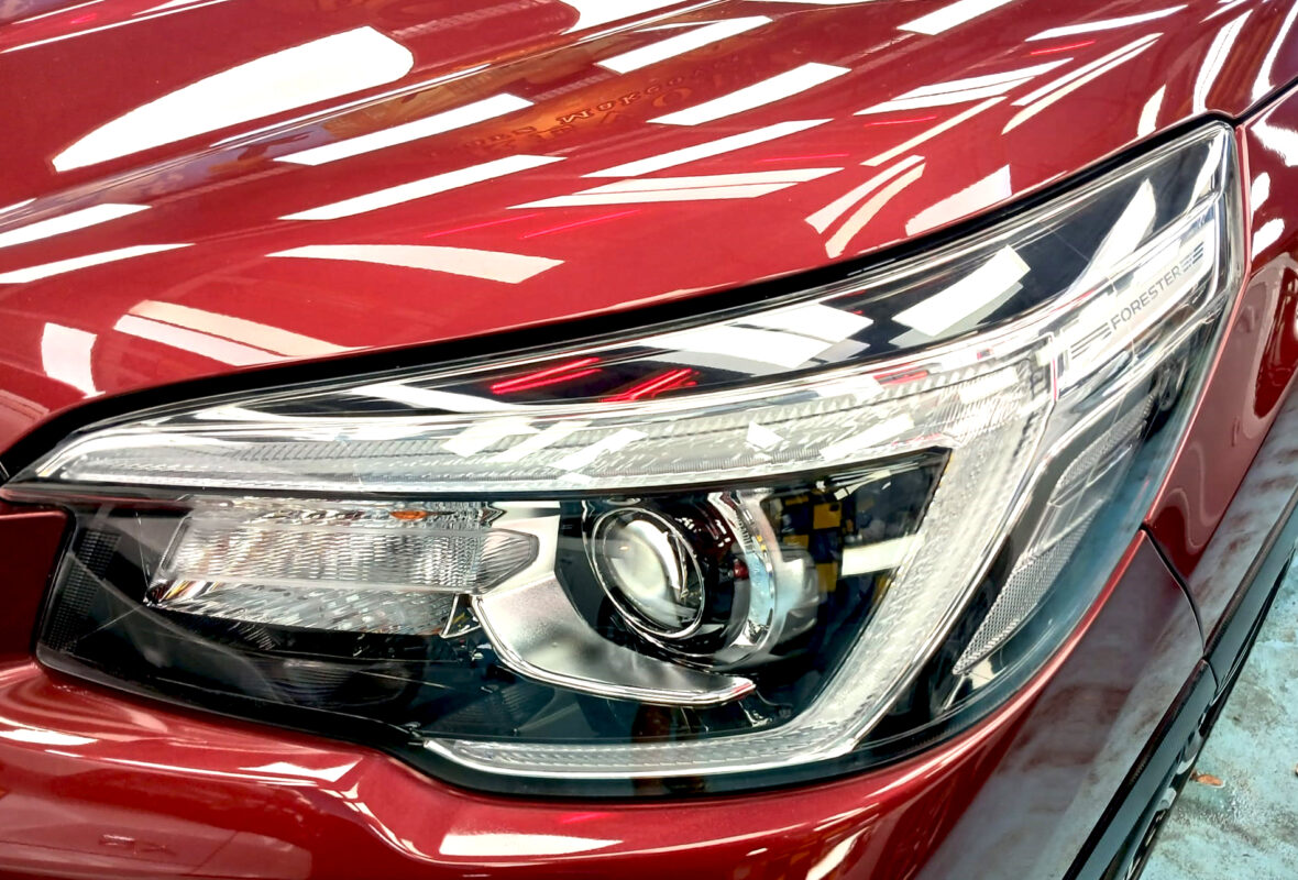 The Forester's coated paintwork showing clean reflections.
