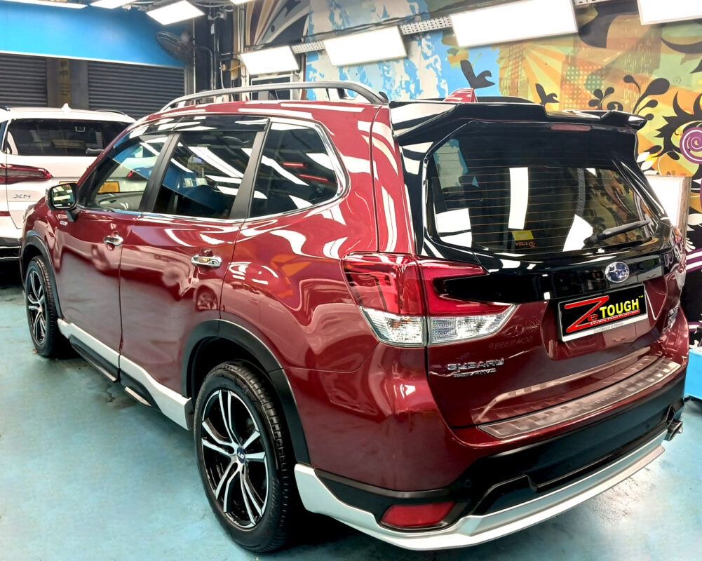The Subaru Forester parked in the workshop, freshly coated.