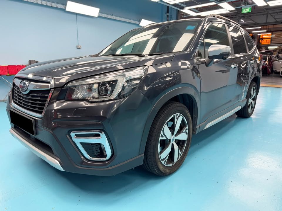 The dark grey Subaru Forester from the front three-quarter as it arrived.