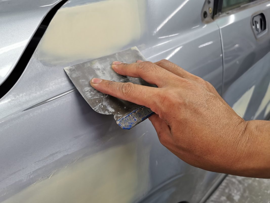 The Forester's body being checked and puttied for paintwork imperfections.