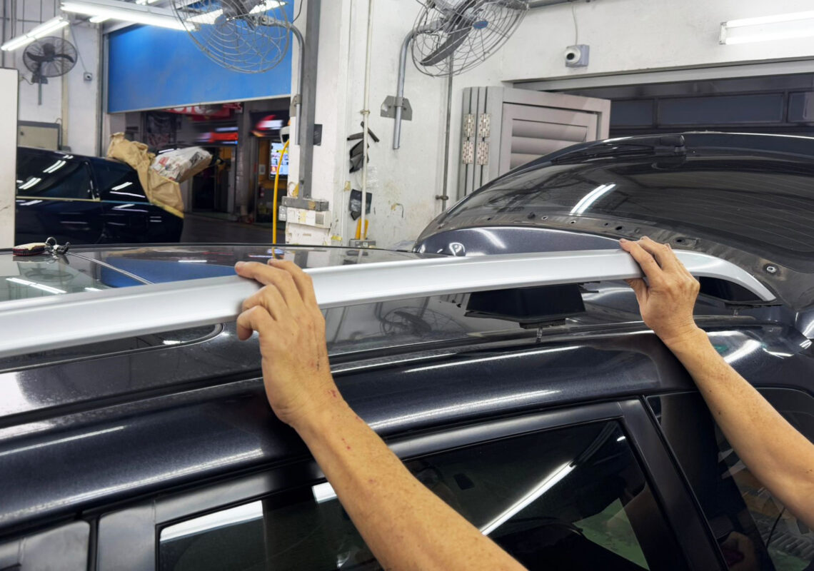 The Subaru Forester stripped down, panels exposed and ready for surface repair.
