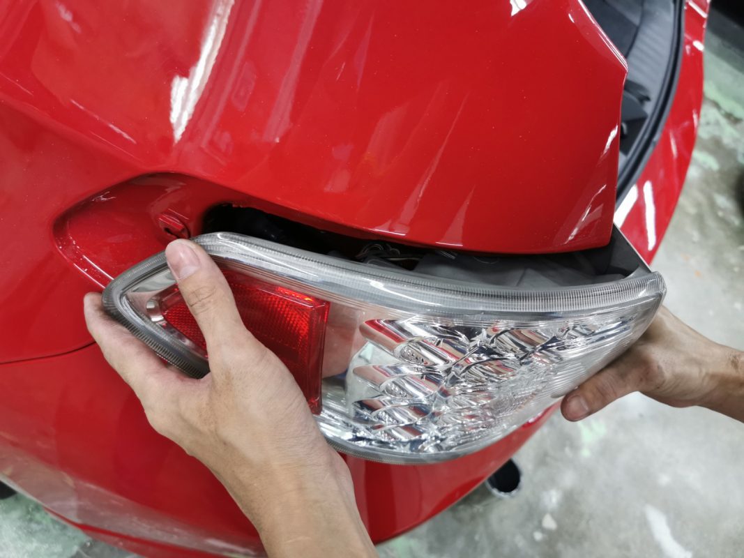 Polishing the newly painted surface of the Impreza to bring up the shine.