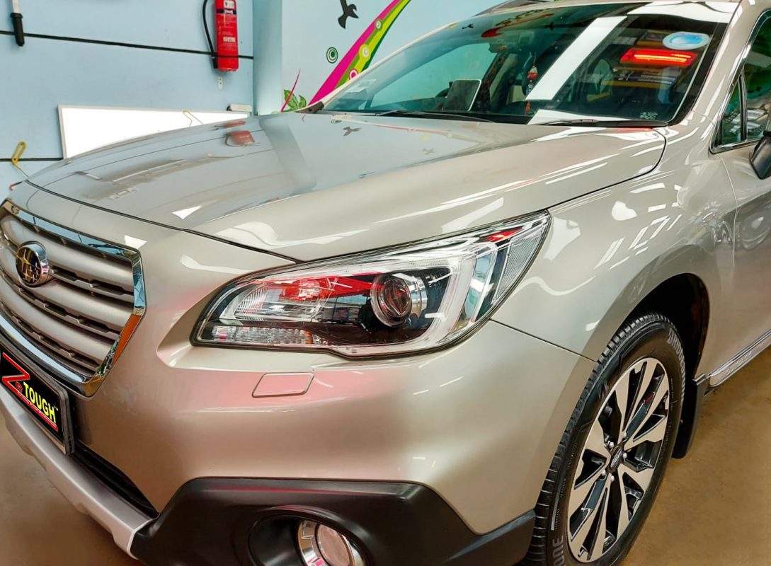 The Subaru Outback from a side angle after the ceramic coating.