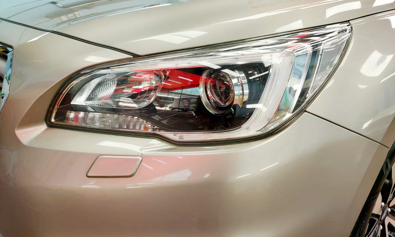 The Outback's coated paintwork showing clean reflections.