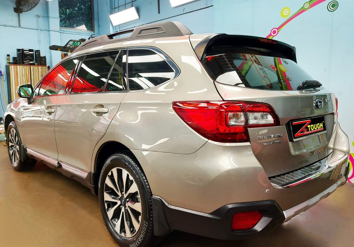 Rear quarter of the Subaru Outback, glossy and protected.