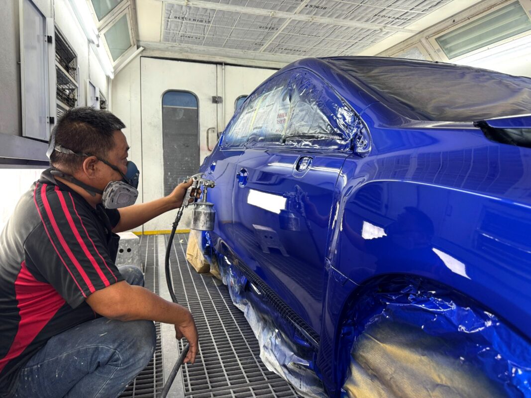 The Subaru WRX after spraying, being wet-sanded back.