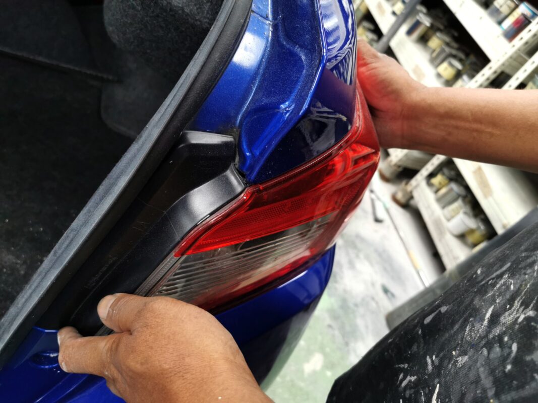 Polishing the new paint on the Subaru WRX to bring up the shine.
