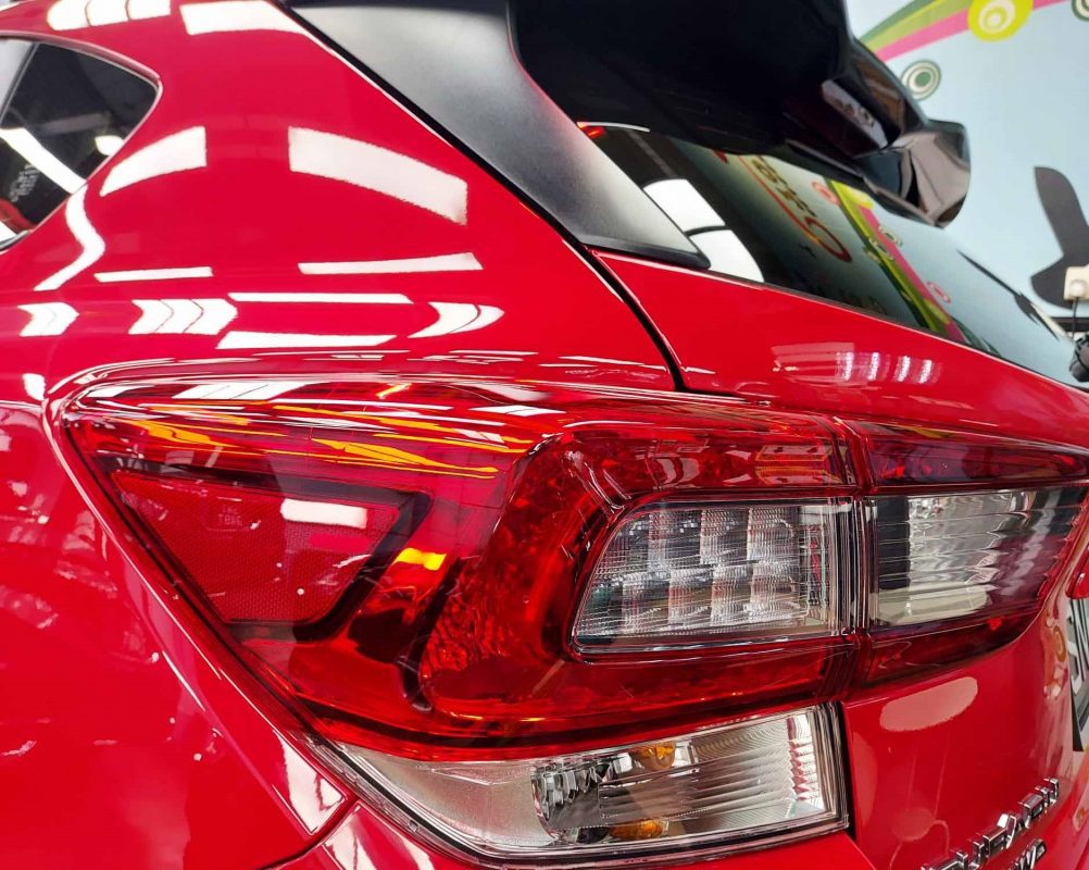 The coated bonnet of the Subaru XV under workshop lighting.