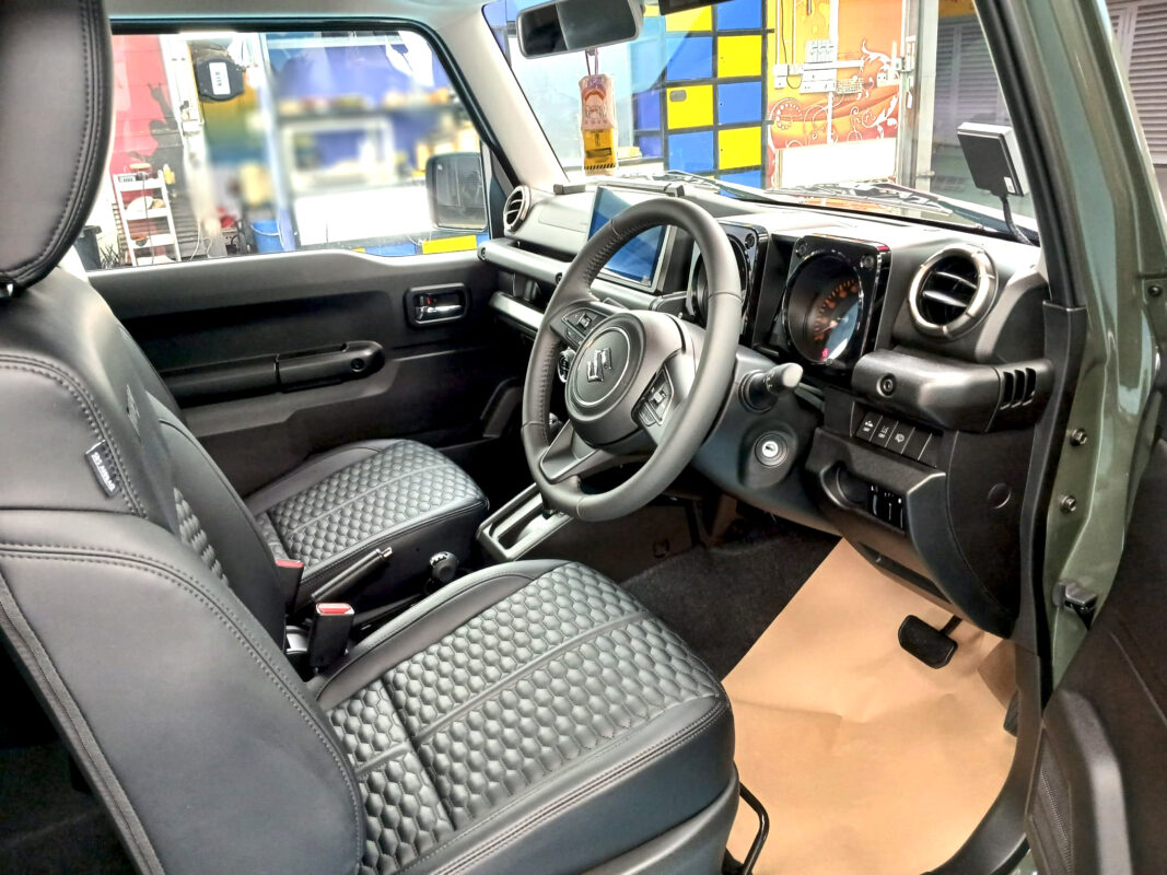 The Suzuki Jimny parked in the workshop, freshly coated.