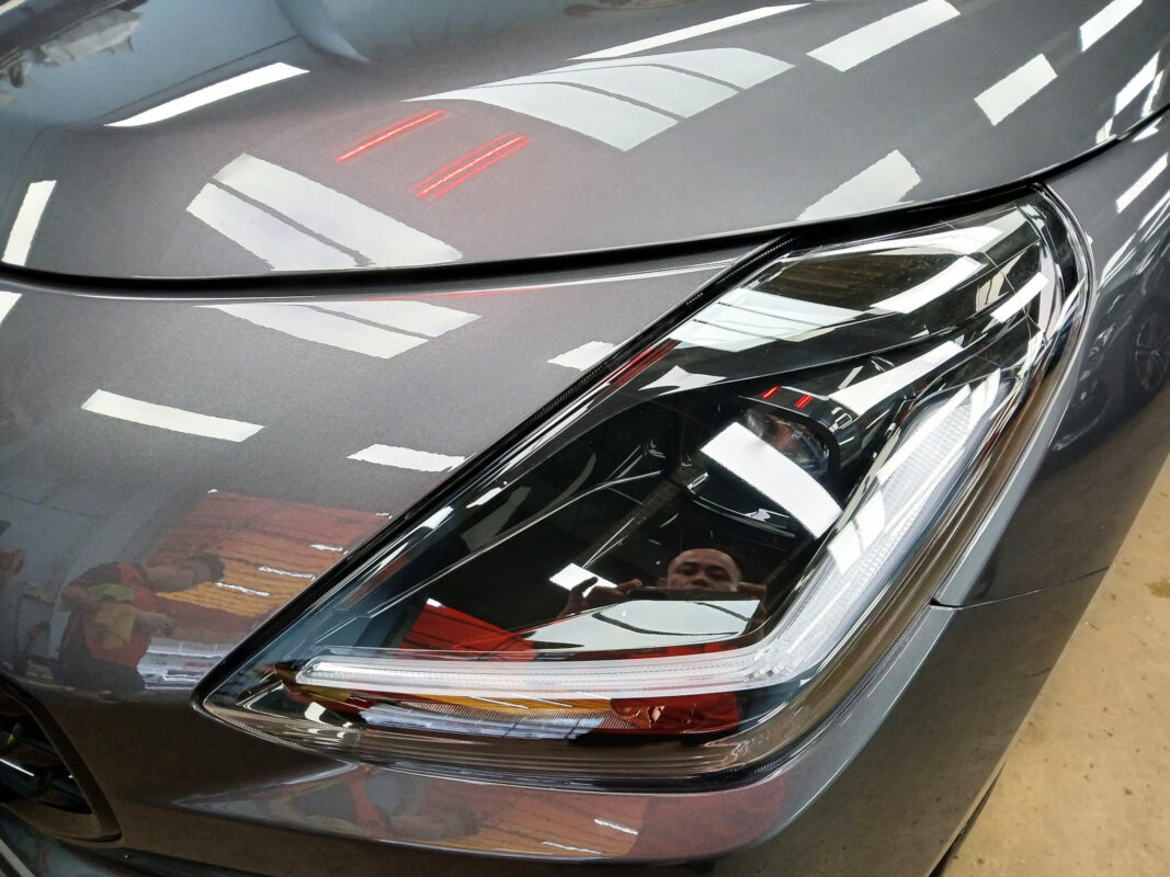 The Swift's coated paintwork showing clean reflections.