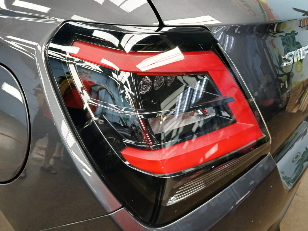 Rear quarter of the Suzuki Swift, glossy and protected.