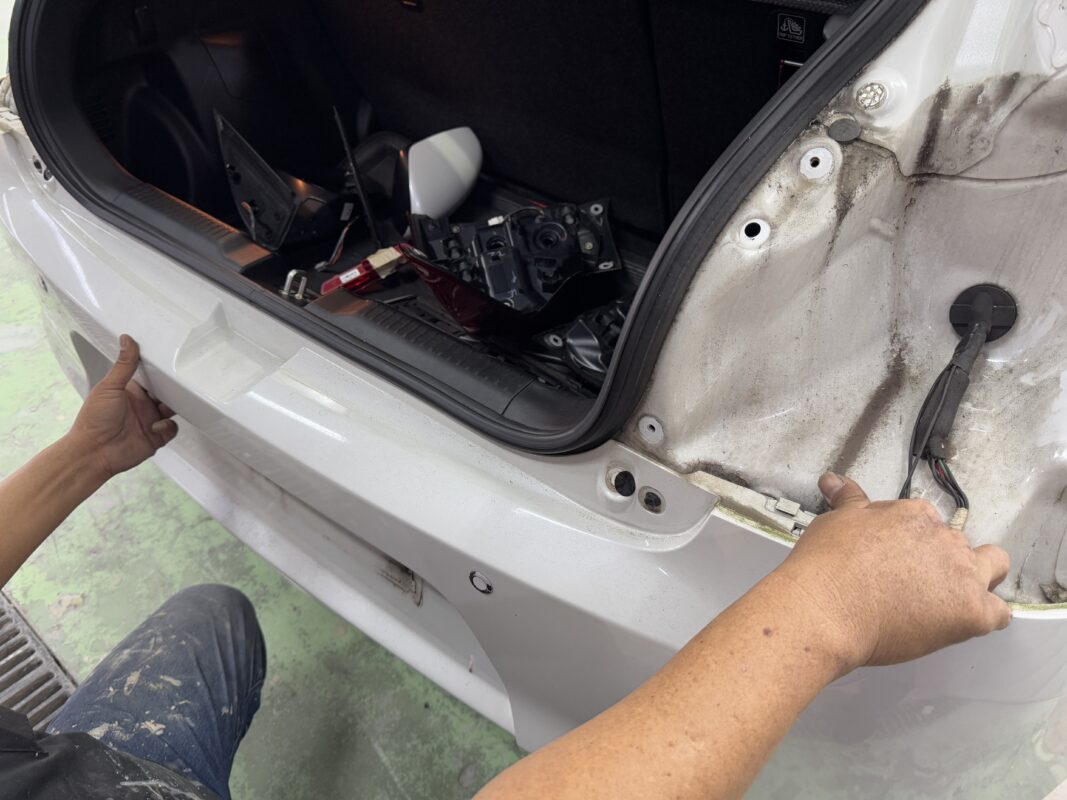 The Suzuki Swift with parts being removed at the start of strip-down.