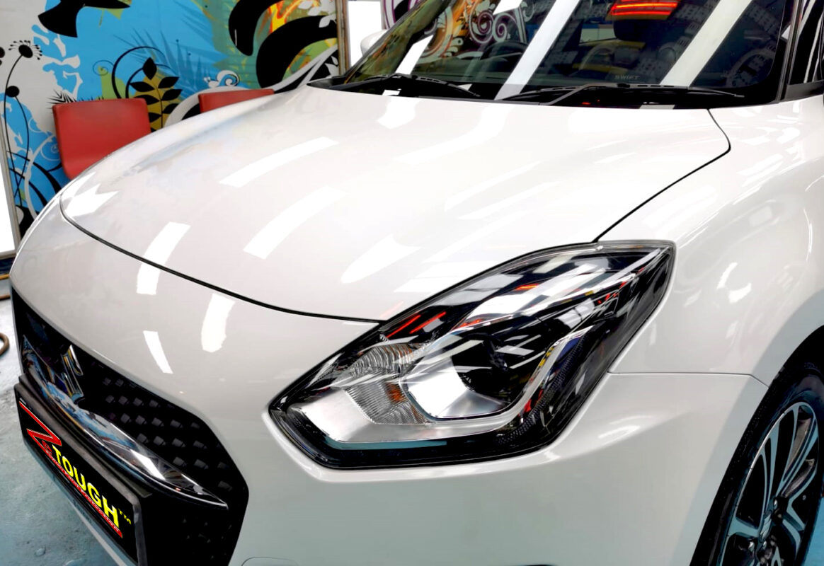 The Suzuki Swift from a side angle after the titanium coating.