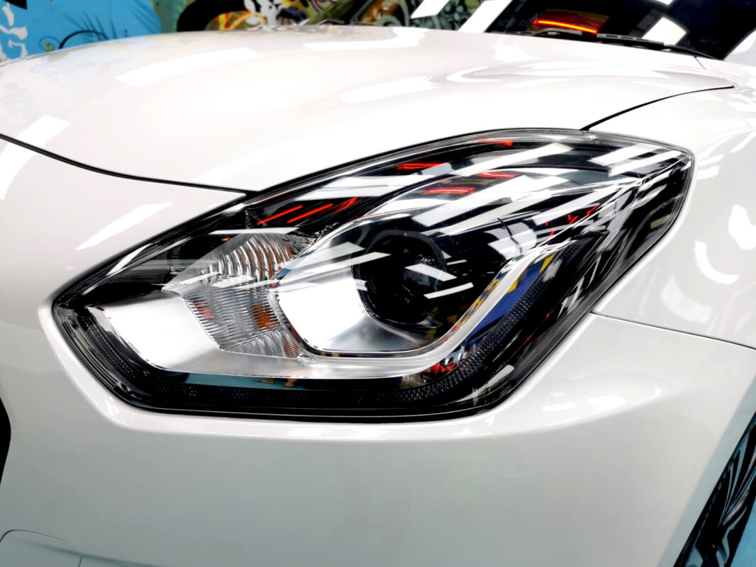 The Swift's coated paintwork showing clean reflections.