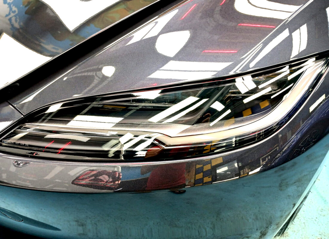 The Model 3's coated paintwork showing clean reflections.
