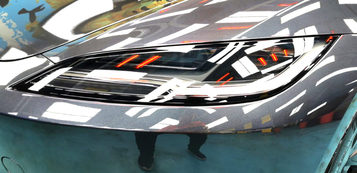 The Model 3's coated paintwork showing clean reflections.