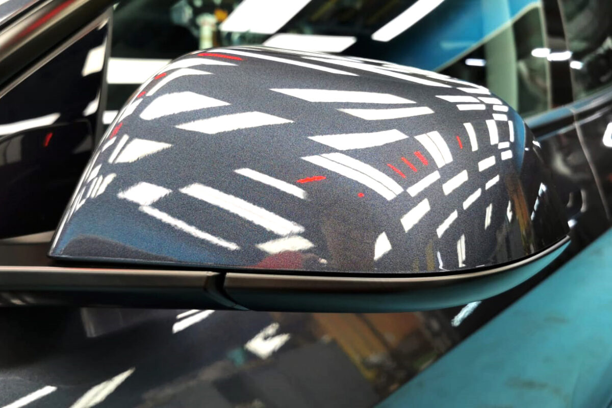 Side panel of the Tesla Model 3 with the titanium finish locked in.