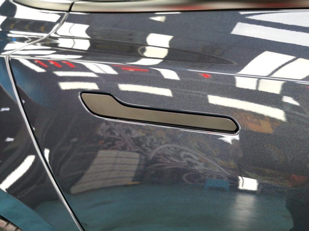The coated paintwork of the Tesla Model 3, clean and sharp.