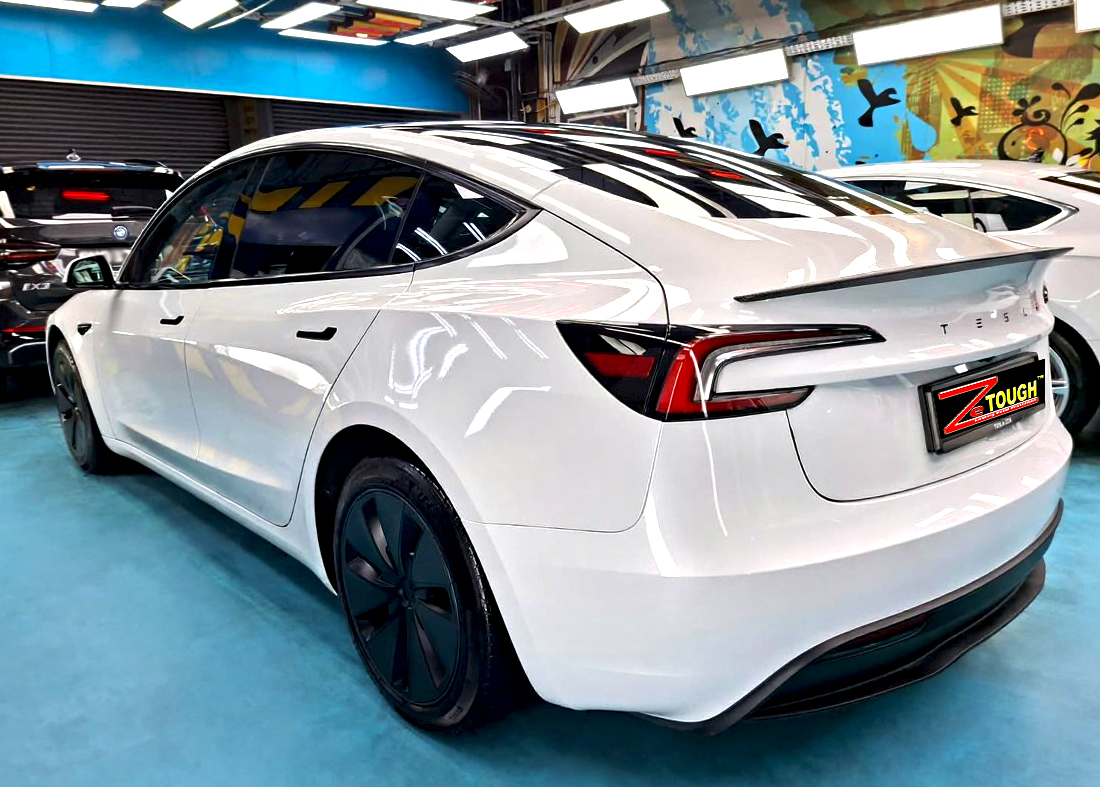 The coated paintwork of the Tesla Model 3, clean and sharp.