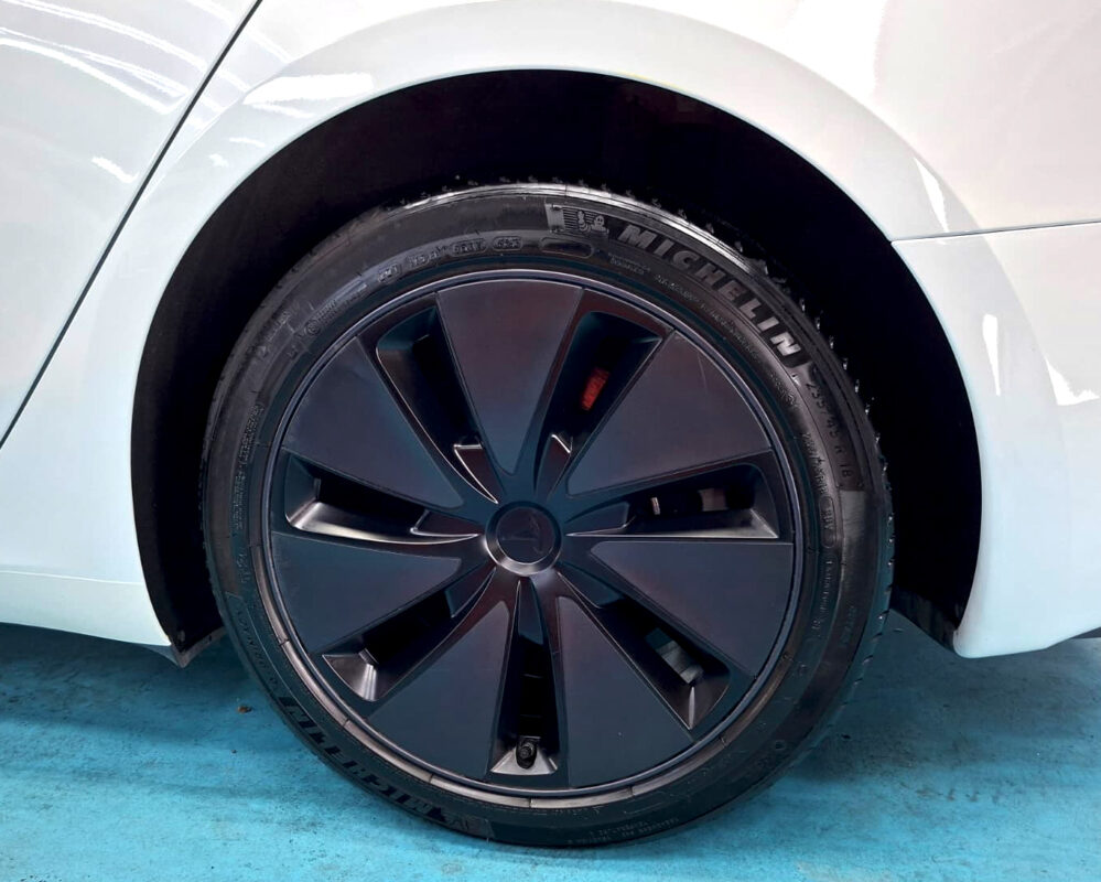 The finished Tesla Model 3, glossy and protected.