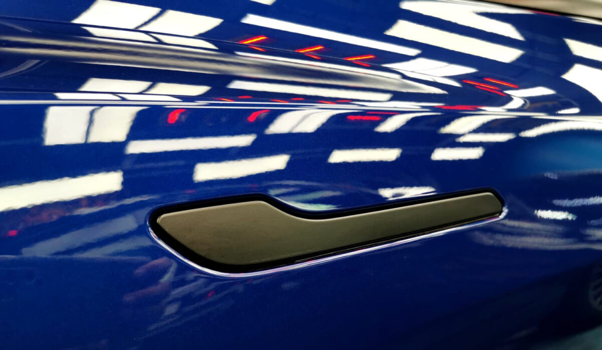 Front three-quarter view of the Tesla Model 3 after coating.