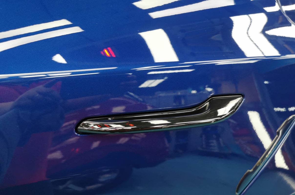 Side panel of the Tesla Model 3 with the ceramic finish locked in.
