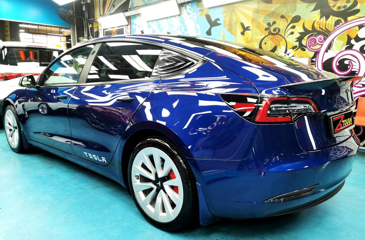 Front three-quarter view of the Tesla Model 3 after coating.