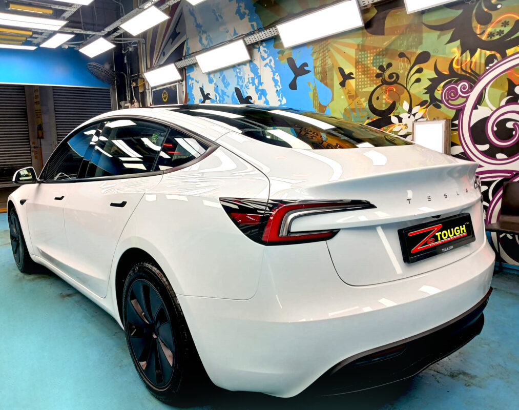 Front three-quarter view of the Tesla Model 3 after coating.