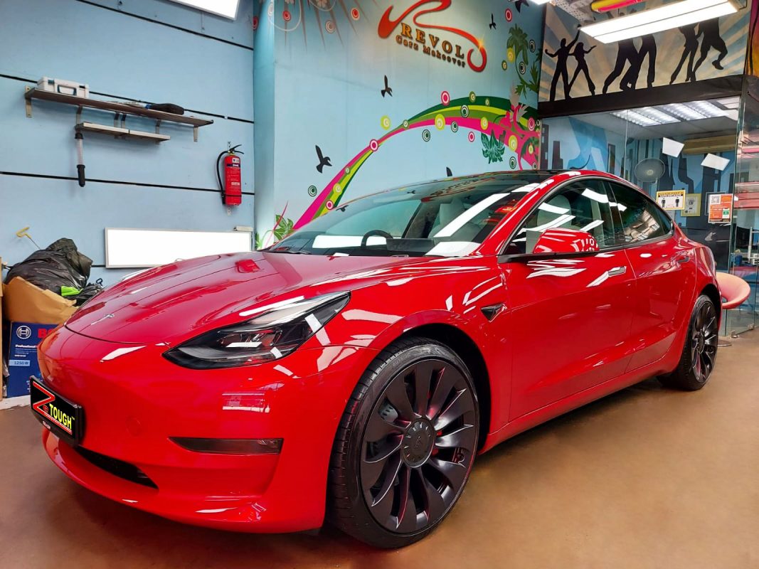 Red Tesla Model 3, sealed with ZeTough Titanium at Revol Carz.