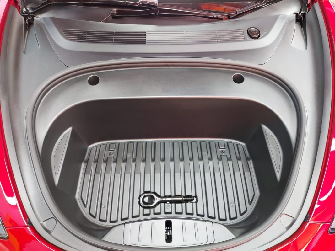 Detail of the red Tesla Model 3's bodywork sealed with ZeTough Titanium.