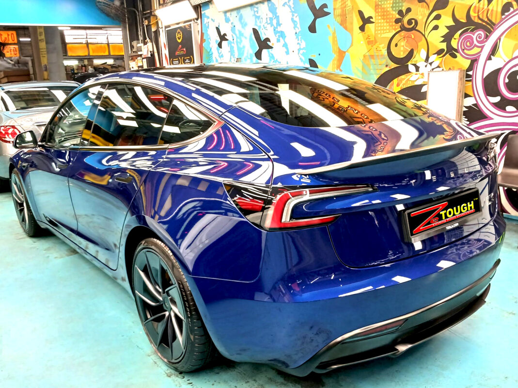 Front three-quarter view of the Tesla Model 3 after coating.