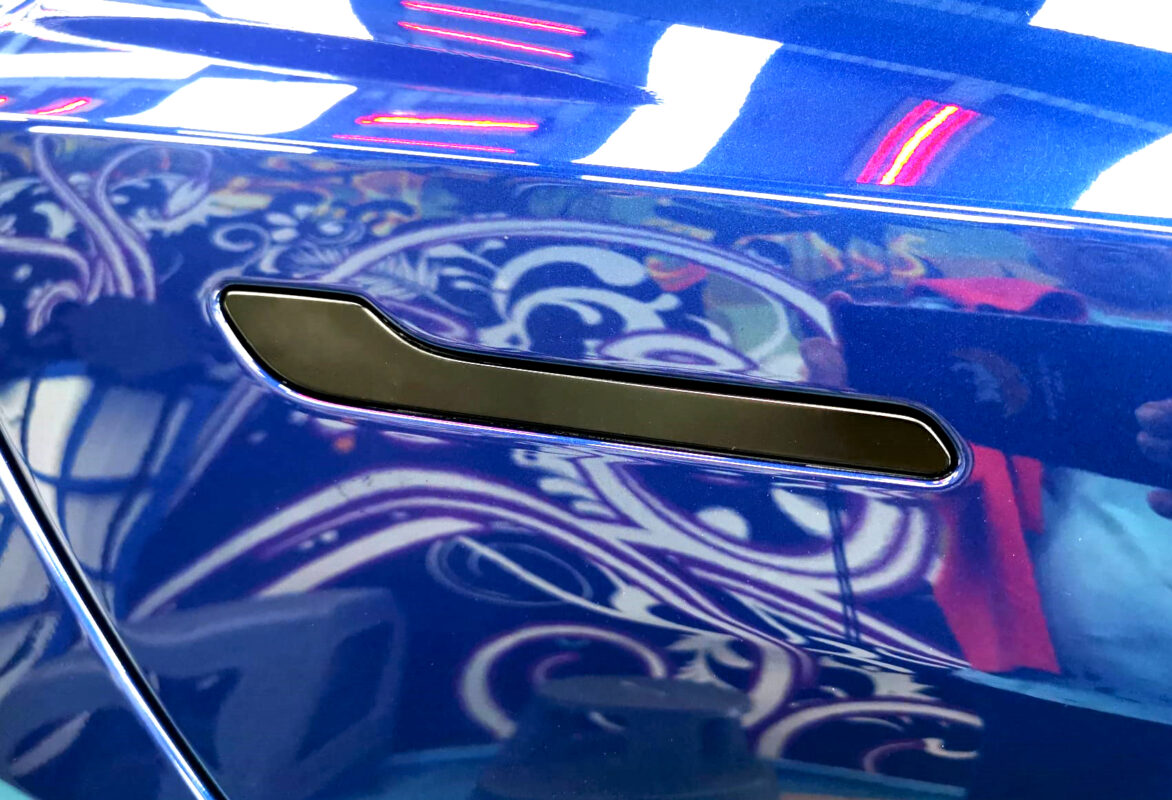 The coated paintwork of the Tesla Model 3, clean and sharp.