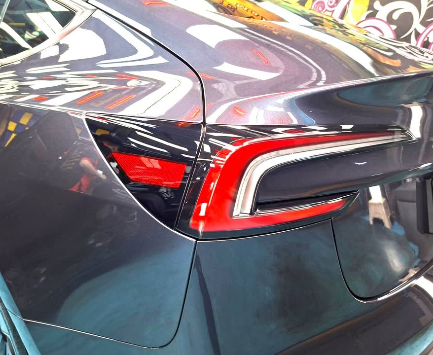 Close-up of the red tail light and rear quarter panel.