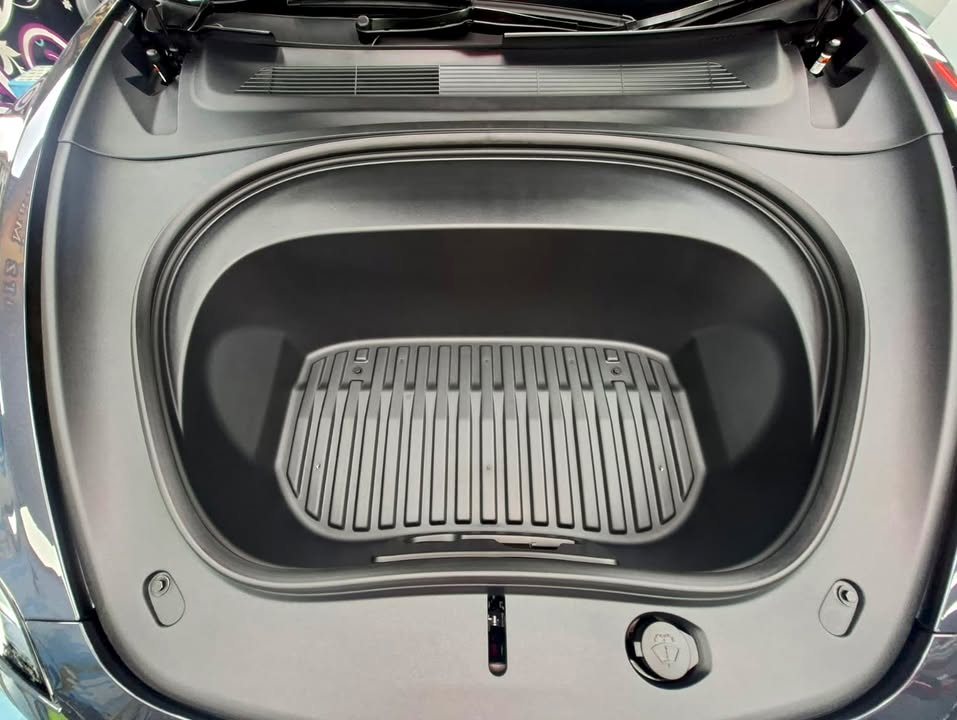 Clean front trunk of the Tesla Model 3 with its rubber liner.