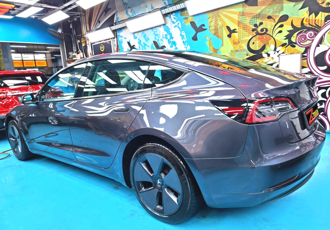 The coated paintwork of the Tesla Model 3, clean and sharp.